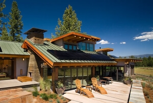modern sloped roofed house sporting SunPower solar panels along most of the structure