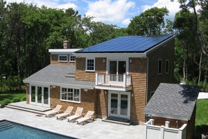 Solar panels covering most of the roof on a large house