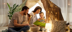 Family reading in play tent